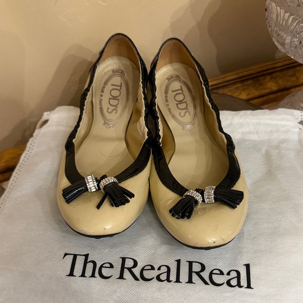Tod's Black and Cream Tassel Flats